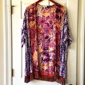 Multi colored Bohemian cardigan with fringe. Pet free smoke free home.
